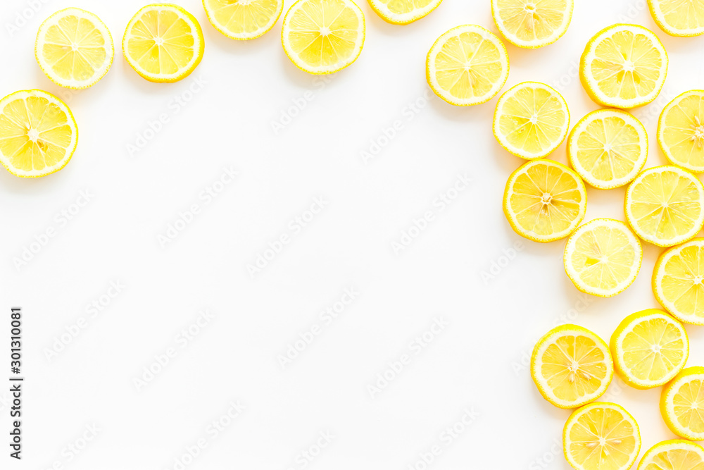 Lemon frame. Sliced citruses on white background top view copy space Lemon frame. Sliced citruses on white background top view copy space