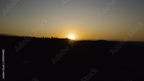 Wallpaper Mural Aerial drone footage of desert valley at dramatic sunset, deserted volcanic landscape, dry, golden yellow sun, black mountains silhouettes in Andalusia, Spain, 4K UHD. Moving to up. Torontodigital.ca