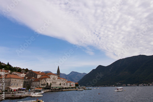 Coastal sea city on the background of mountains and sky. Perast. Montenegro.
