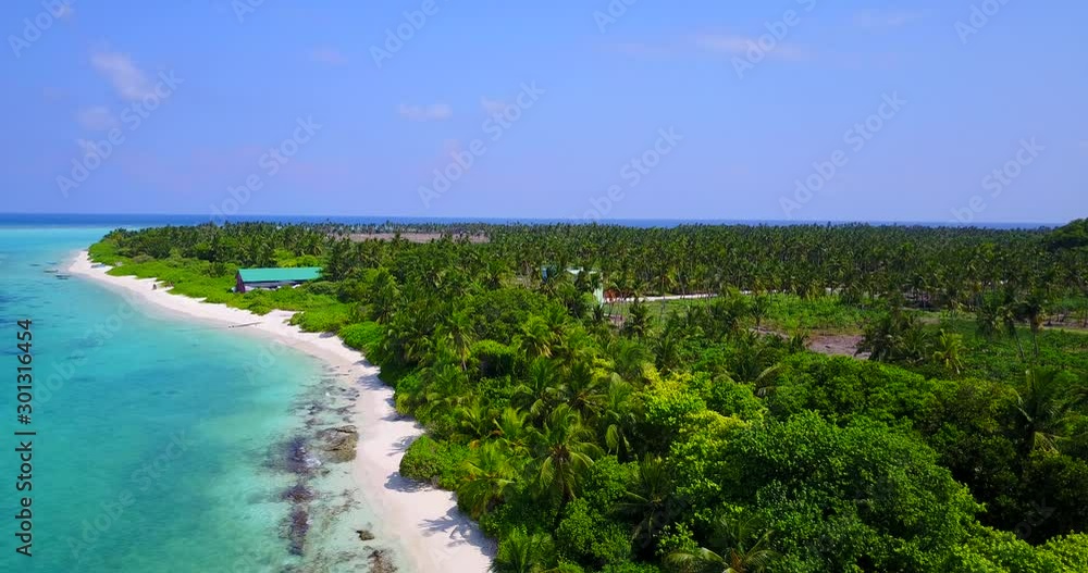 Beautiful Green Island In a Stunning Location With White Sand and Clear Blue Sky in the Background in Cuba - Aerial shot Beautiful Green Island In a Stunning Location With White Sand and Clear Blue Sky in the Background in Cuba - Aerial shot