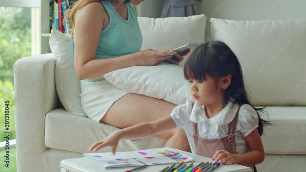 Daughter shows picture drawn to mother proud in little girl Daughter shows picture drawn to mother proud in little girl
