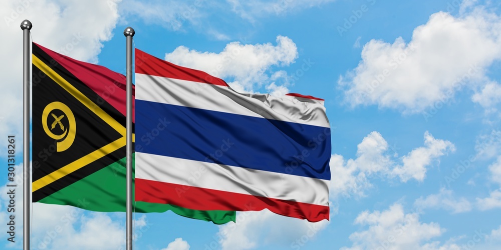 Vanuatu and Thailand flag waving in the wind against white cloudy blue sky together. Diplomacy concept, international relations.