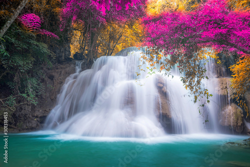 Amazing in nature, beautiful waterfall at colorful autumn forest in fall season © totojang1977