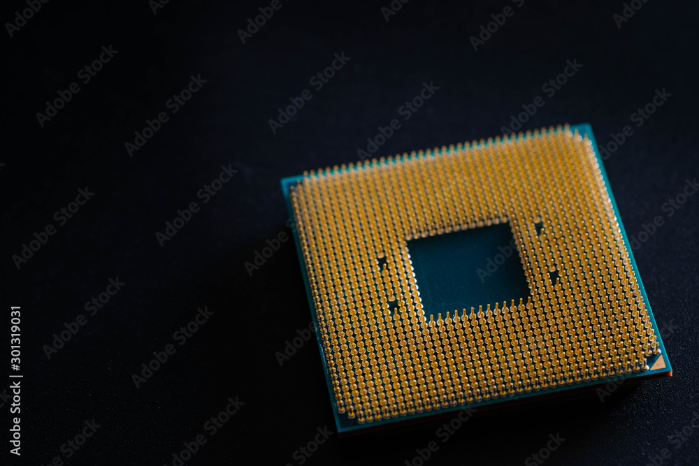 Closeup CPU pins on a green printed circuit board, Golden pins is The micro elements of computer central processor unit, GPU objects isolated on Black background . Closeup CPU pins on a green printed circuit board, Golden pins is The micro elements of computer central processor unit, GPU objects isolated on Black background .
