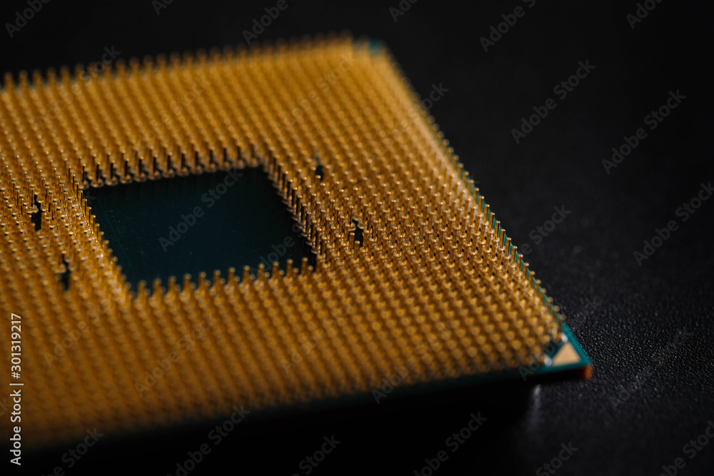 Closeup CPU pins on a green printed circuit board, Golden pins is The micro elements of computer central processor unit, GPU objects isolated on Black background .