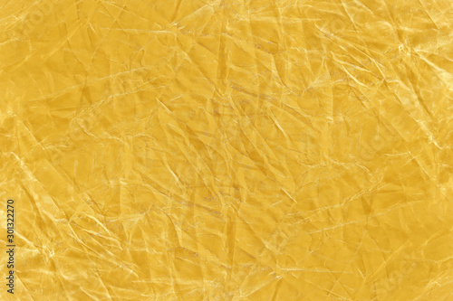 Golden fabric, wrinkles texture abstract background