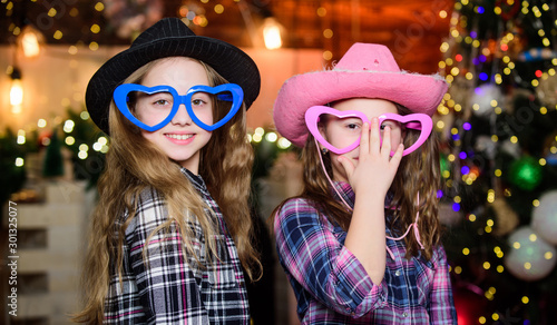 Invitations for party. little girls sisters. Christmas shopping. cowgirl children. Xmas tree. Holiday shopping. Little girl in cowboy hats. Shopping day. Christmas time. Shopping sale. Happy new year photo