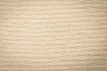 Hessian sackcloth woven texture pattern background in light yellow cream brown