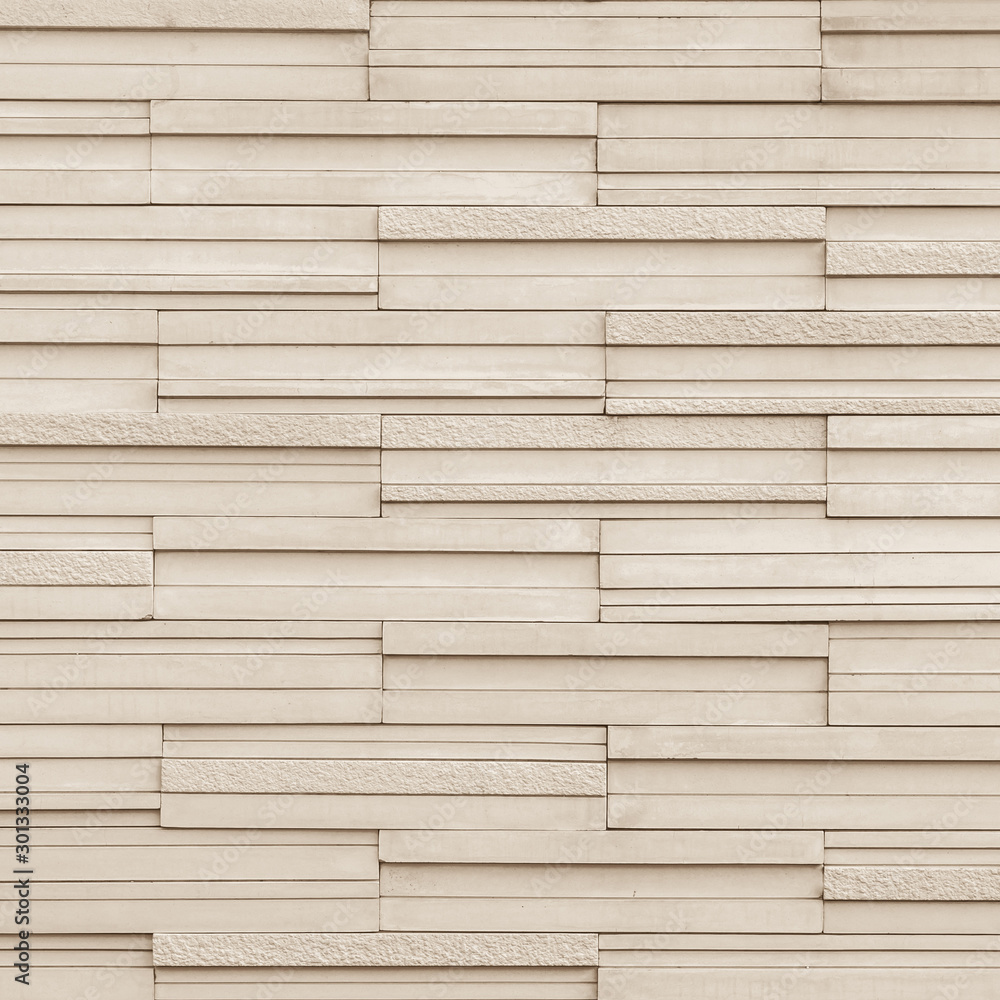 Obraz premium Granite tiled detailed pattern texture background in natural light pastel sepia creme beige color