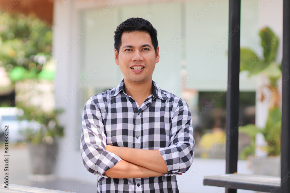 Portrait of Asian man looking at camera with happiness Portrait of Asian man looking at camera with happiness