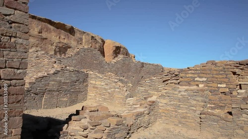 Panning around the ruins of Chetro Ketl at Chaco Canyon in New Mexico. The walls were built almost a thousand years ago by the Anasazi people. The cool brick walls still stand. May have been religious