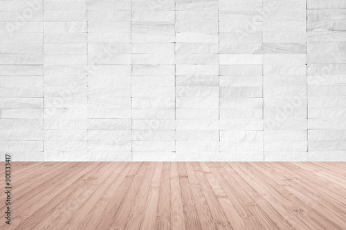 White rock tile wall with wooden floor in red brown color for interior background.