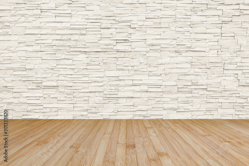 Limestone rock tile wall backdrop in light cream beige color with wooden floor in yellow brown