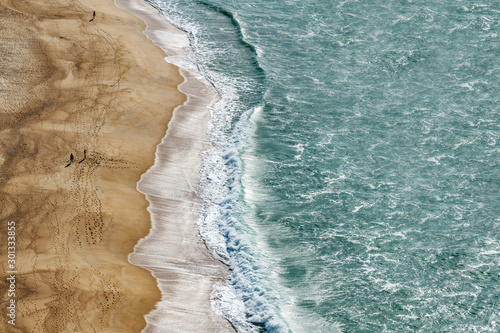 Evening time by Atlantic ocean in Nazare, Portugal.