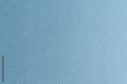 Silk authentic natural fabric wallpaper texture background in dark shiny blue jean grey color tone