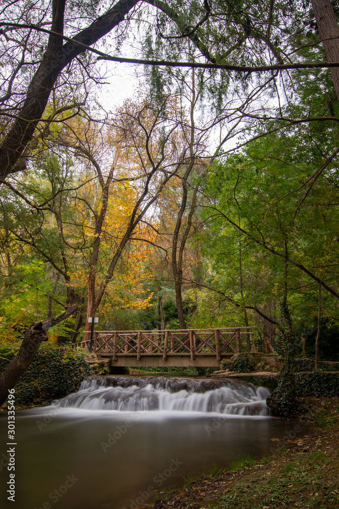 river with waterfall in the autumn season river with waterfall in the autumn season