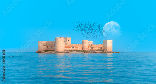The maiden s castle  Kiz Kalesi  with full moon -  Mersin Turkey  Elements of this image furnished by NASA