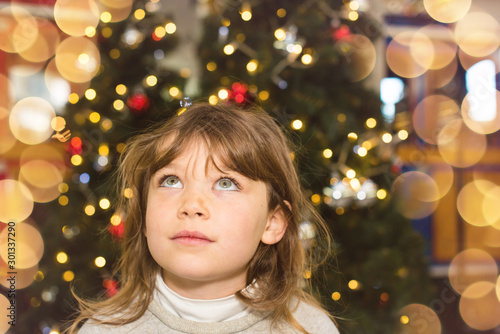 beautiful girl waiting for the opening of gifts