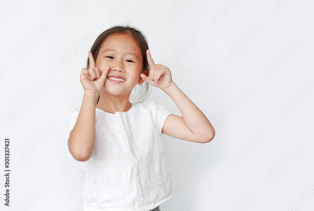 Happy little girl raised two forefinger to cheer isolated on white background. Cheerful emotion concept. Happy little girl raised two forefinger to cheer isolated on white background. Cheerful emotion concept.