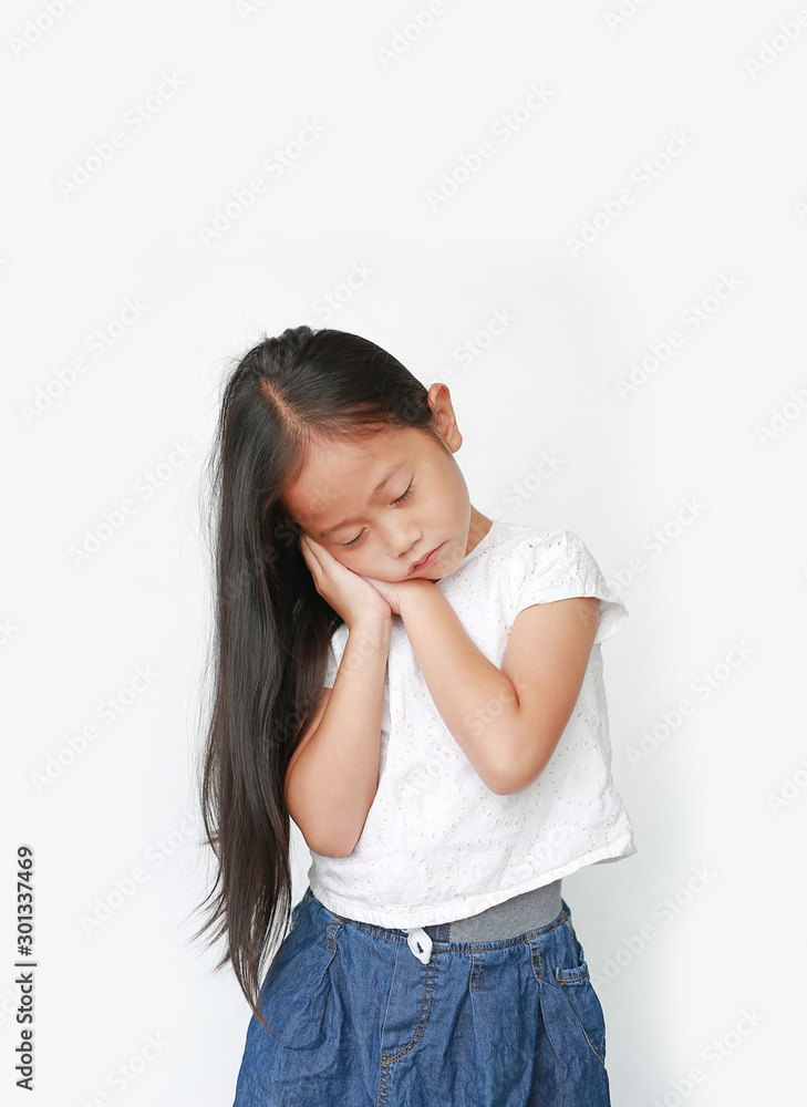 Closed eyes caucasian little child girl sleep gesture posing with hands togethe isolated over white background. Closed eyes caucasian little child girl sleep gesture posing with hands togethe isolated over white background.