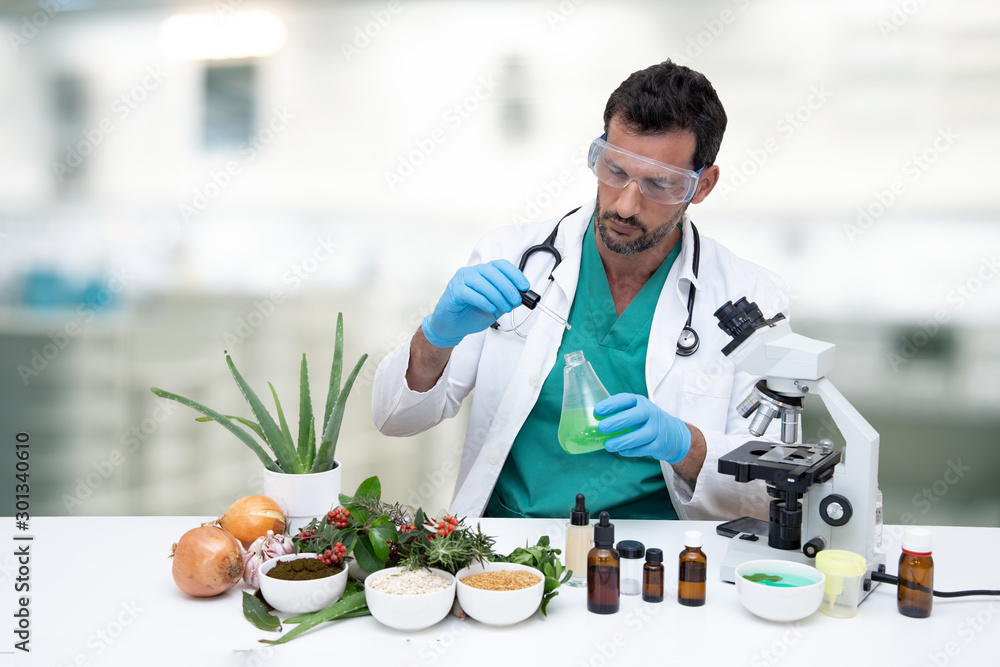 scientific doctor in the laboratory, analyzing herbs and medicinal plants, next to a microscope scientific doctor in the laboratory, analyzing herbs and medicinal plants, next to a microscope