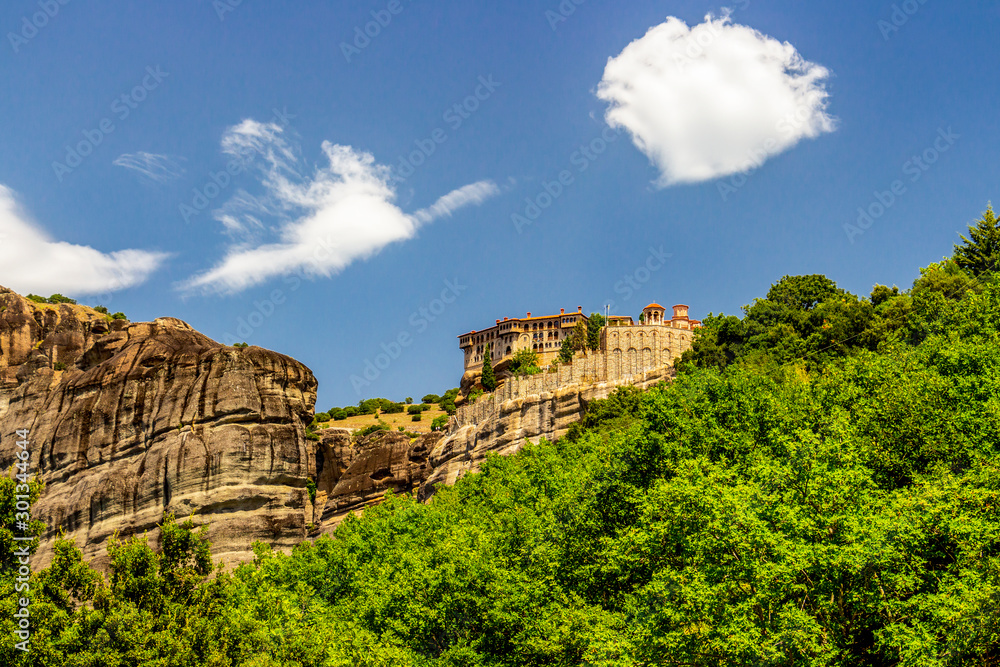Scenic view of Meteora Valley with rock formations and the Holy Monastery of Varlaam, part of the Eastern Orthodox monastery complex of Meteora, Central Greece