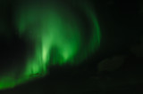 amazing aurora borealis made in iceland, incredible patterns cover the sky, green light plays with unusual patterns