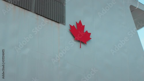 Coat of arms of the state of Canada on board a warship.