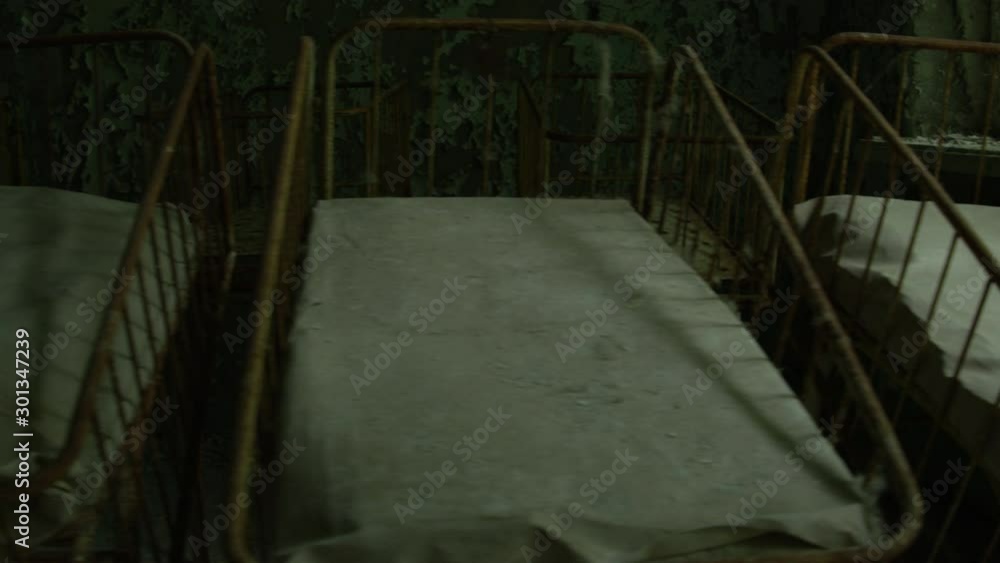 Abandoned Hospital in Pripyat Ukraine. Tracking Shot of Baby Nursery inside Chernobyl Exclusion Zone Abandoned Hospital in Pripyat Ukraine. Tracking Shot of Baby Nursery inside Chernobyl Exclusion Zone