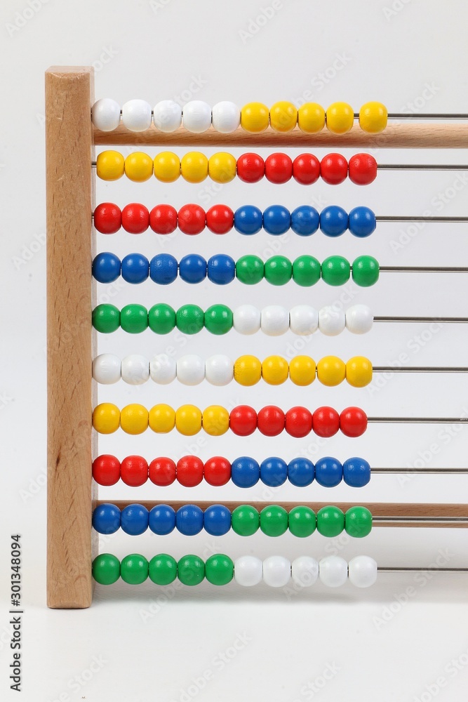 small ruler with colorful wooden balls in a white studio small ruler with colorful wooden balls in a white studio