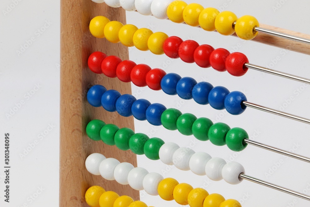 small ruler with colorful wooden balls in a white studio small ruler with colorful wooden balls in a white studio