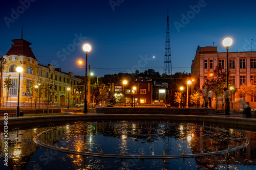 Photography evening in the city near fountain