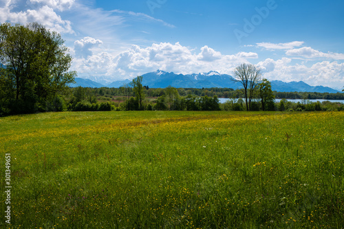 The sky and landscape in Bavaria, closed to the mountains the alps with beatufil clouds, fields and lakes 