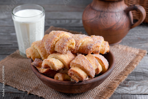 Tasty baked rolled or bagels cookies with sugar photo