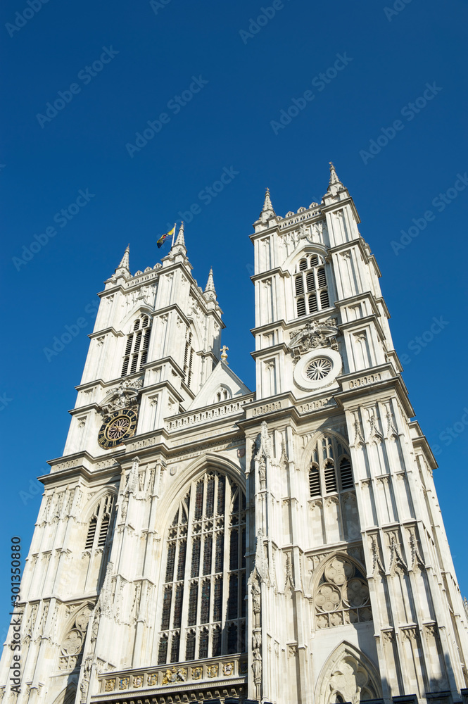 Bright sunny exterior view of  Westminster Abbey under blue sky in London, UK