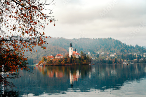 Autumn landscape with lake Bled and church in Slovenia photo