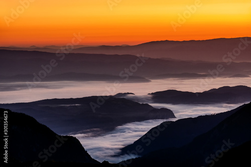 The julians alps mountain range during sunrise and sunset with the epic mountains and colour in Slovenia