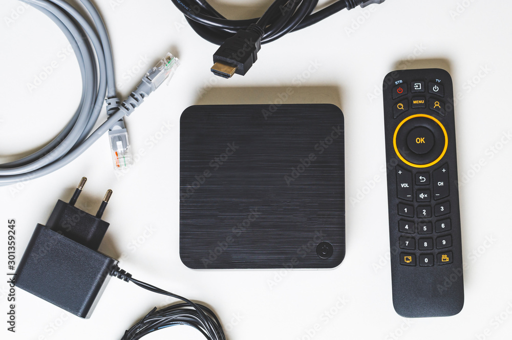 Set top box and all the necessary wires to connect it top view Stock