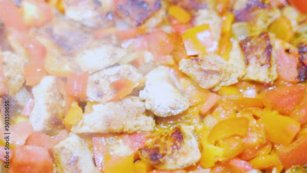Close-up food delicious colorful dinner lunch meat with vegetables stewed fried boiling and Smoking in a pan, macro, slow motion Close-up food delicious colorful dinner lunch meat with vegetables stewed fried boiling and Smoking in a pan, macro, slow motion