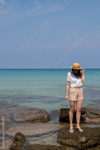 Young woman on the shore of a beautiful bay in Thailand, Koh Kood island
