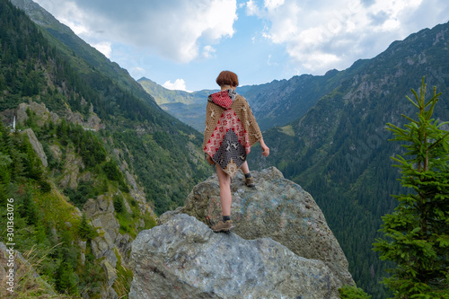 Young woman traveler in the mountains