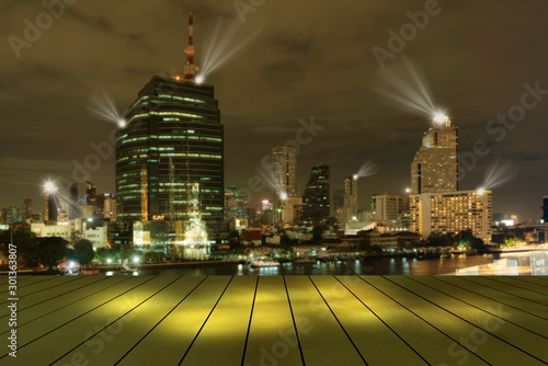 top golden metal desk with cityscape night lights view blur background