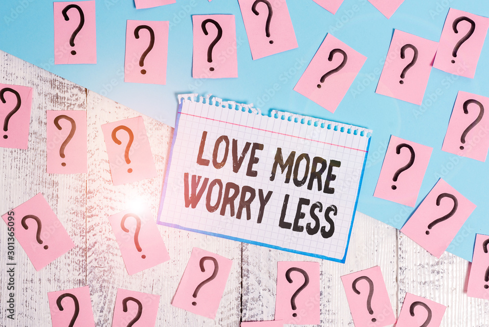 Writing note showing Love More Worry Less. Business concept for Have a good attitude motivation be lovable enjoy life Scribbled and crumbling papers with thick cardboard above wooden table Writing note showing Love More Worry Less. Business concept for Have a good attitude motivation be lovable enjoy life Scribbled and crumbling papers with thick cardboard above wooden table