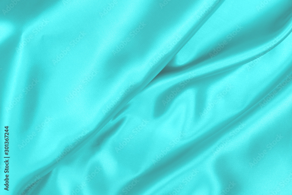 Fototapeta premium Cyan-Teal satin fabric texture soft blur background