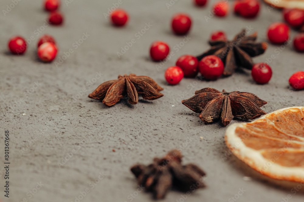 Berries and spices for mulled wine cooking close up on kitchen table