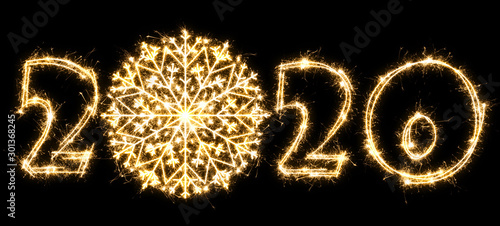 New Year 2020 with snowflake made by sparkler . Number 2020 and sign written sparkling sparklers . Isolated on a black background . Overlay template for holiday greeting card .