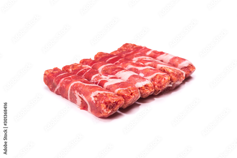 Chevapchichi in bacon isolated on white background. Chevapchichi in bacon isolated on white background.