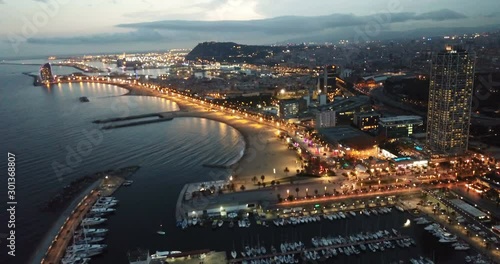Famous Barceloneta beach on Mediterranean in Barcelona in night lights