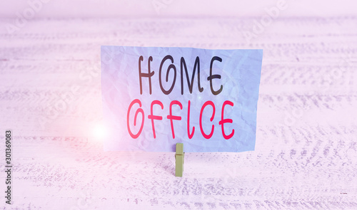 Word writing text Home Office. Business photo showcasing space designated in a demonstrating s is residence for official business Green clothespin white wood background colored paper reminder office