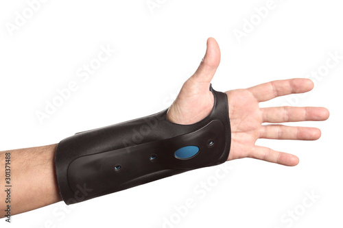human hand with a wrist brace, orthopedic equipment isolated on white background with clipping path and copy space for your text